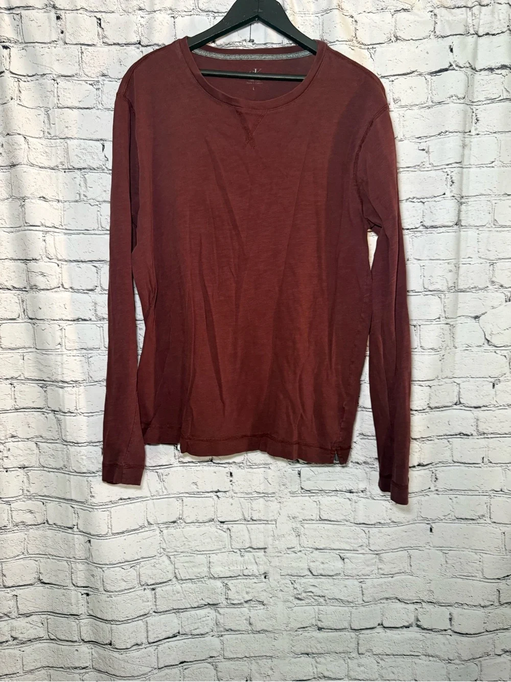 Calvin Klein. Maroon long sleeve. Size L